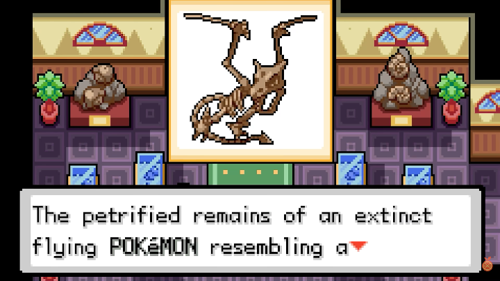 A fossil exhibit describes the remains of an extinct flying Pokemon